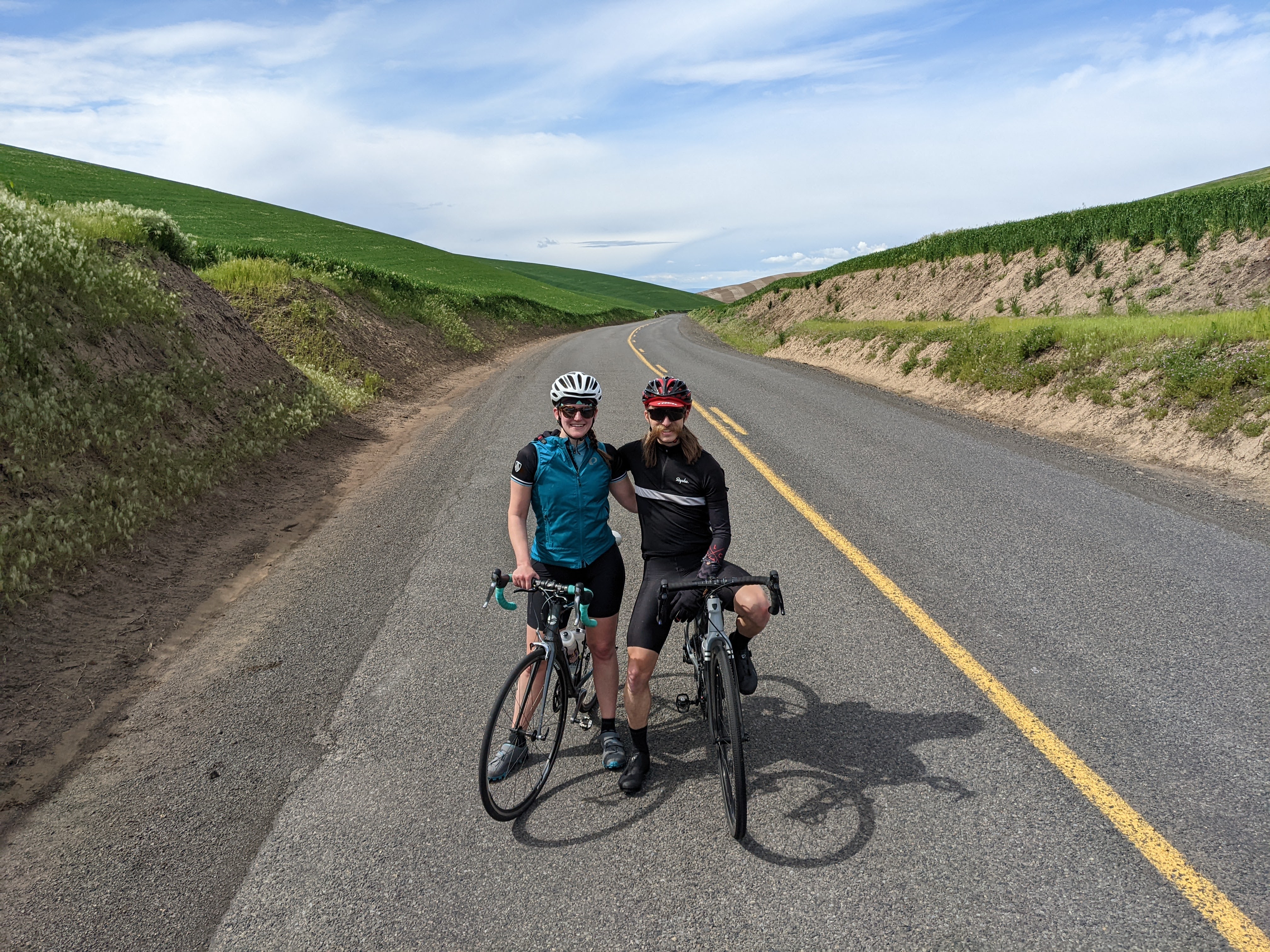 Alex Brasch and his partner Margaret cycling outside of Walla Walla, Washington