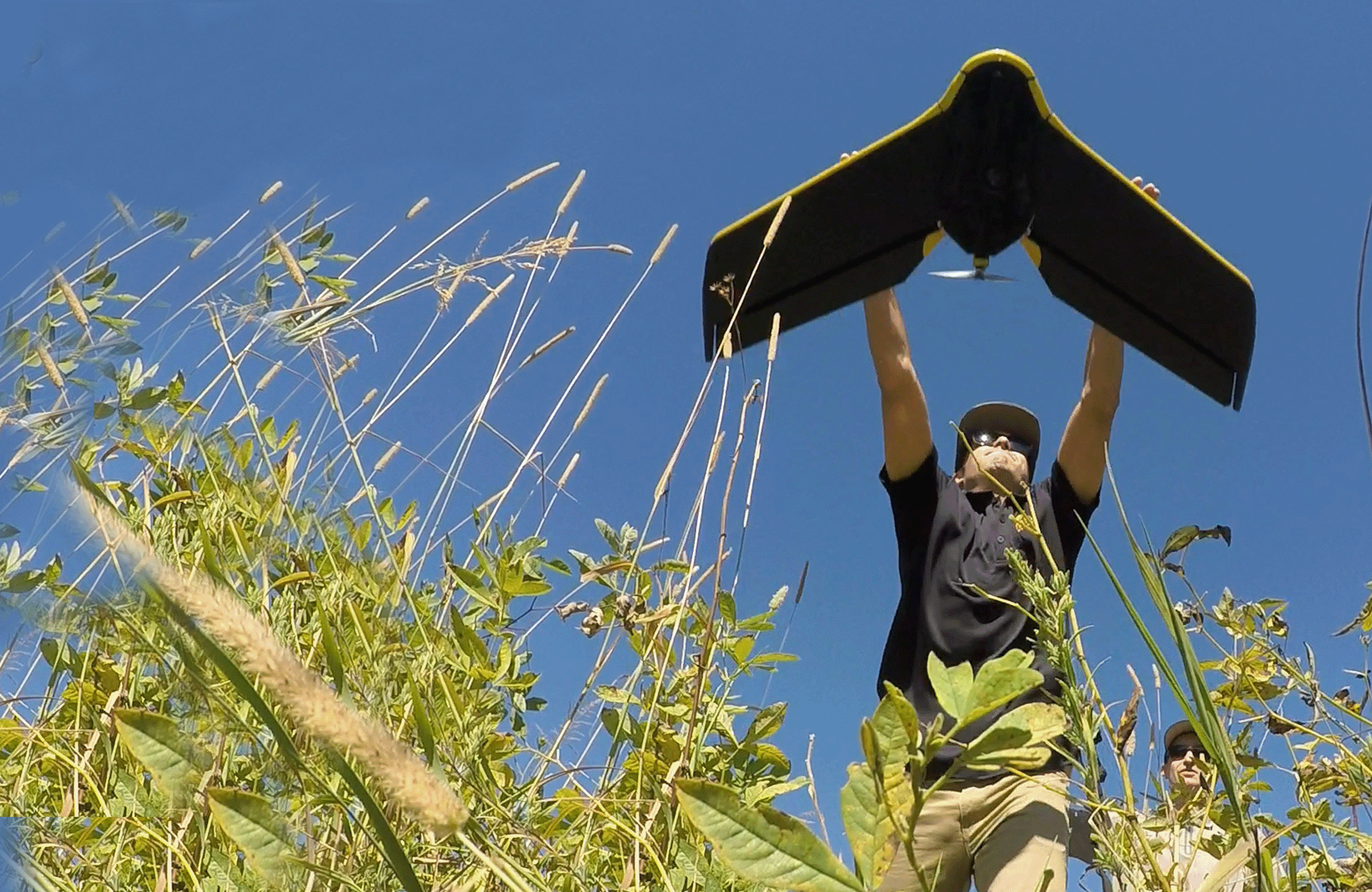 FLO employee launching UAV