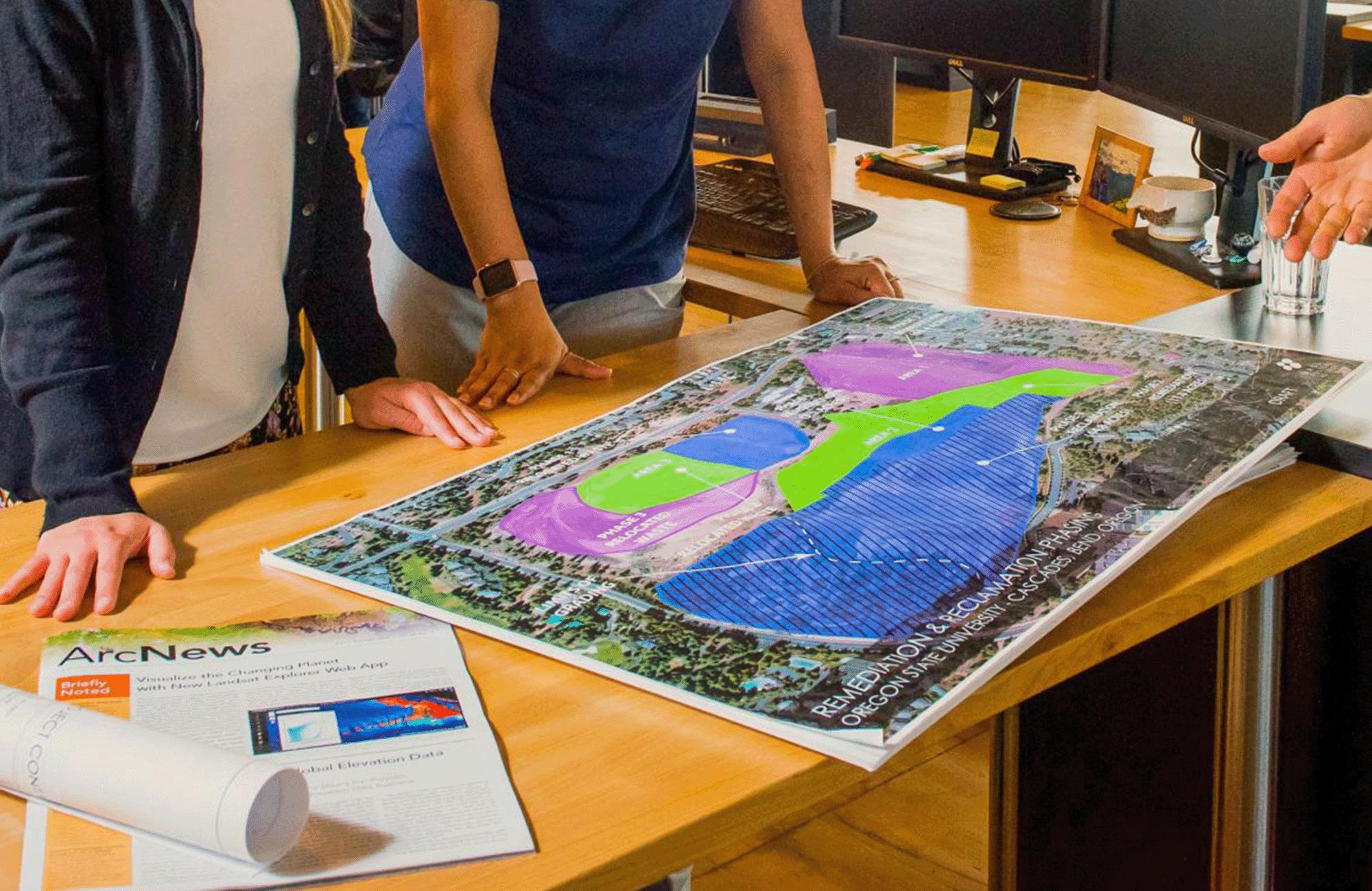 Group of people looking over remediation map