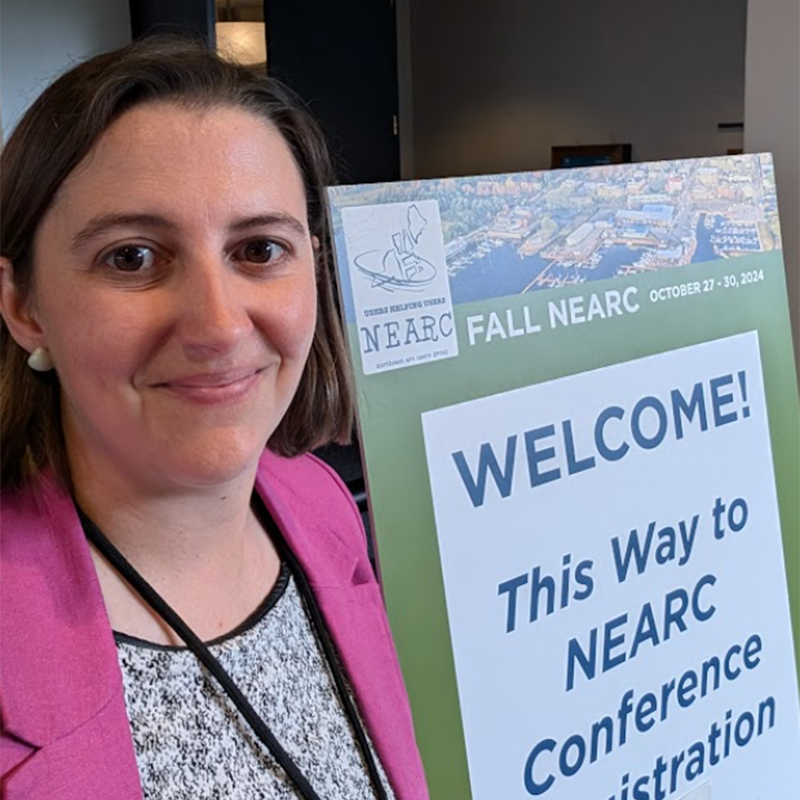 FLO employee posing at the NEARC Conference.