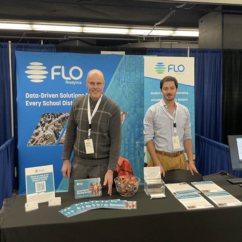 FLO employees working a conference booth
