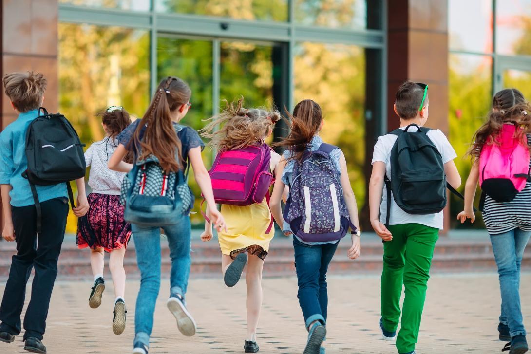 students approaching a school building